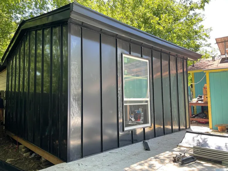 Black standing seam metal wall panels for Roof Inspection in Lindenhurst